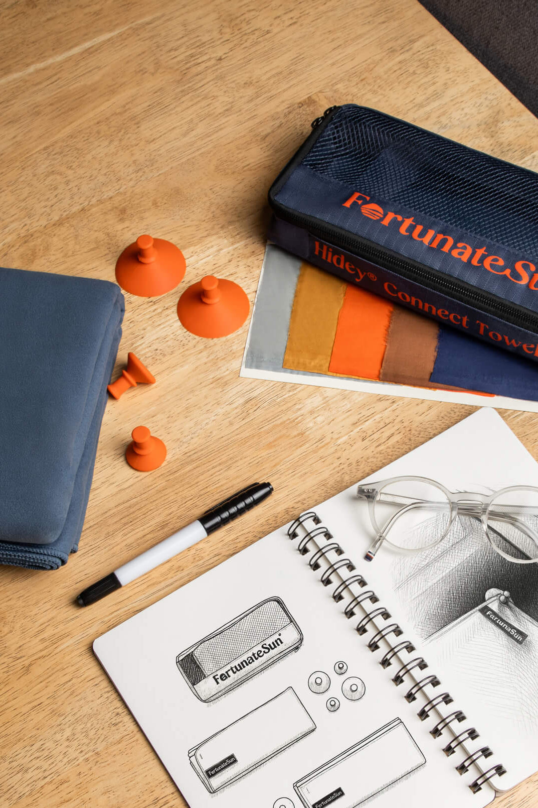 Fortunate San Hidey towel kit with accessories on a wooden surface